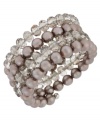 Wrap star. This coil bracelet from Kenneth Cole New York is crafted from silver-tone mixed metal with taupe glass pearls and cherry beads making a bold fashion statement. Item comes packaged in a signature Kenneth Cole New York Gift Box. Approximate length: 7-1/2 inches. Approximate width: 1-1/4 inches.