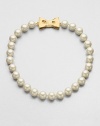 A classic styled piece in pearl-like beads with a sweet goldtone bow closure. Plastic beadsGoldtoneLength, about 18Tongue and box closureImported 