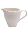 Evoking the natural exuberance of thrown pottery, the Mikasa Swirl creamer brings unfussy elegance to your table in classic stoneware. Creamer not shown.