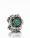 Birthstone accents add a personal touch to PANDORA's floral charm.