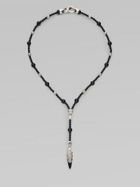 A handsomely crafted sterling silver pendant hangs from a strand of onyx beads. Sterling silver Onxy Pendant, about 1½ long Necklace, about 22 long Imported 