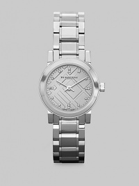 A sleek stainless steel design that features an iconic check dial with diamond markers. Quartz movementWater resistant to 5 ATMRound stainless steel case, 26mm (1)Smooth bezelSilvertone check dialSixteen diamond hour markersStainless steel link braceletMade in Switzerland 