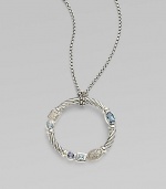 From the Confetti Collection. A wreath-shaped cable pendant, luxuriously set with pavé diamonds and other gemstones, dangles from a sterling silver chain. Diamonds, 0.05 tcw Blue topaz and iolite Sterling silver Chain length, about 16 Pendant diameter, about 1 Lobster clasp Made in USA