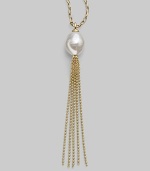 A striking white baroque pearl is the centerpiece of this delightful design, accented with a tassel of delicate gold chains. 16mm baroque, organic, man-made white pearl 18k gold vermeil Length, about 36 Made in Spain