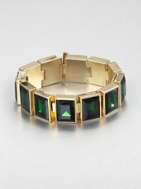 From the Cocktail Collection. Bold faceted stones of rich emerald-colored glass sit all in a row in this striking design of polished goldtone.GlassGoldtoneLength, about 7Width, about .75Bar claspImported