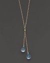 Twin blue topaz briolettes sparkle from this 14K yellow gold lariat necklace.