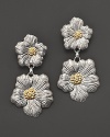 Delicate gardenias, captured at the height of their beauty in sterling silver and 18K yellow gold, bloom on these earrings from Buccellati.