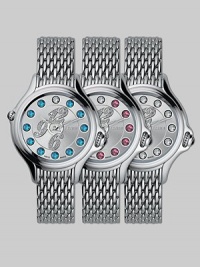 Dazzling topaz stones surround diamond-encrusted numerals on this classic, stainless steel design, featuring a unique rolling gemstone mechanism that changes the semiprecious markers for three different looks, with a single stationary diamond at 12.Swiss quartz movement Water resistant to 3 ATM Round stainless steel case, 38mm, (1.49) Silver dial Topaz and single diamond markers, 2.9 tcw Arabic numeral hour markers Bracelet strap Made in Switzerland