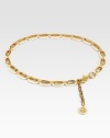 Glossy resin links accented with radiant goldtone details and an iconic logo charm. Width, about 1Imported 