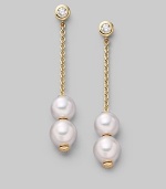 From the Pearls in Motion Collection. Delicate chains of 18k gold dangle from diamond studs and hold white Akoya pearls that slide up and down but stay where you place them. 7mm white round cultured pearls Quality: A+ Diamonds, 0.14 tcw 18k yellow gold Drop, about 1¾ Post back Imported