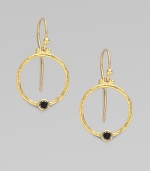 From the Clover Collection. A simple, delicate hoop of 24K gold with a single black diamond accent.Black diamond, 0.24 tcw 24K yellow gold Width, about ¾ Length, about 1 Ear hooks Imported 