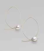 A delicate marquis shape, delineated in 14k gold wire, is capped by a lustrous pearl for a modern twist on a classic hoop. White freshwater baroque pearls 14k yellow gold Length, about 1¾ Width, about 1 Pierced Made in USA