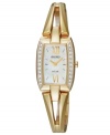 This solar-powered watch by Seiko shines with a golden bangle bracelet adorned with shimmering details.