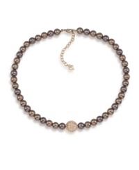 Autumnal appeal. Gorgeous brown glass pearls and a sparkling fireball charm make this Carolee necklace a perfect addition for your fall wardrobe. Crafted in gold tone mixed metal. Approximate length: 16 inches + 2-inch extender.