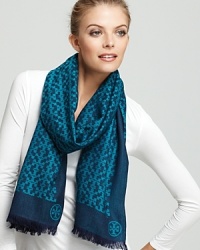 Tory Burch's iconic T is beautifully represented in this patterned oblong scarf.