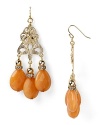 Gold medallions and faceted stones capture exotic casbah cool. Earrings by Lydell NYC.