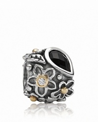 An onyx 'dew drop' stone grounds a sterling silver PANDORA charm with gold and diamond-accented floral motifs.