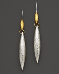 Hammered white silver drop earring cast in an oblong teardrop with 24 Kt. yellow gold accents.