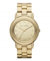 Suit up for glam squad duty with this mirrored Marci watch by Marc by Marc Jacobs. Gold ion-plated stainless steel bracelet and round case. Gold tone mirrored dial features logo letter markers and three hands. Quartz movement. Water resistant to 50 meters. Two-year limited warranty.