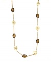 Great lengths: Jones New York's long chain necklace is elegantly enhanced by smoky topaz-hued stones and disc accents. Crafted in gold tone mixed metal with plastic stones. Approximate length: 36 inches.