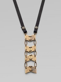 A stunning pendant formed of linked antiqued brass panels boldly suspends from a strap of Italian leather.BrassLeatherLength, about 27½Lobster claspMade in USA