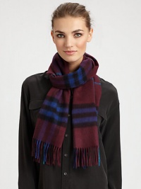 Luxurious cashmere wrap is adorned with an outstanding check design with fringe trim.Cashmere47 X 11Dry cleanImported