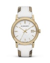 This Burberry watch makes an unforgettable impression. Crafted of gold-plated stainless steel with a bold, checked band, it models distinctive, designer style.