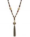 Lauren Ralph Lauren's lovely necklace features a trendy tassel design with semi-precious tiger's eye beads and glass, resin and wood accents. Approximate length: 32 inches + 2-inch extender. Approximate drop: 5-1/2 inches.