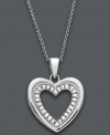 Sweet simplicity. Capture her heart with Victoria Townsend's diamond heart pendant. Crafted in sterling silver and decorated by an inner row of round-cut diamonds (1/4 c.t. t.w). Approximate length: 18 inches. Approximate drop: 1 inch.