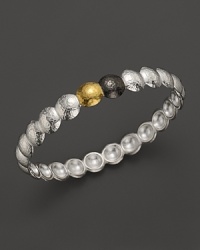 Single 24K gold and dark silver details lend intrigue to Gurhan's sterling silver Lentil bangle.