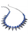 Look sharp with this necklace from Bar III. Crafted from hematite-tone mixed metal, the necklace is adorned with spikes and blue glass crystals for a bit of fashion on the edge. Approximate length: 16 inches + 2-inch extender.