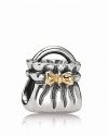 A 14K gold bow adds glamour to PANDORA's sterling silver purse charm.