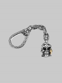 Skull-motif charm with a solid 18k gold cross accent on an engraved sterling silver clasp. About 4 long Made in USA