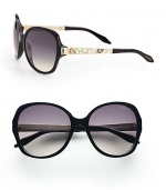 Chic round style with python printed leather accented temples on a lightweight, plastic frame. Available in black/ivory python/rose gold with smoke gradient lens. Python printed leather and logo accented temples100% UV protectionMade in Italy 