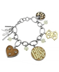 Fashion in a flash. This fierce style from GUESS features a leopard print circle, a gold tone quatro G, a brown heart with silver tone studs, silver tone numbers showing 1981, and a brown and gold tone logo circle. Chain crafted in imitation rhodium-plated mixed metal. Approximate length: 7-1/2 inches. Approximate drop 1-1/2 inches.