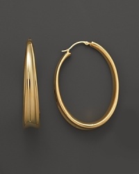 These bold 14K. gold hoops are a fresh take on the classic silhouette.