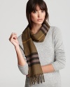 Bundle up in Burberry's soft cashmere scarf with signature giant check print.