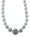 This tinsel-colored necklace will add an extra twinkle to your outfit. Crafted by Carolee, necklace features graduated pewter glass pearls, charcoal glass pearls and sparkling crystal glass fireballs. Set in silvertone mixed metal. Approximate length: 16 inches + 2-inch extender.