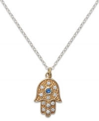 Symbolic and stylish, Studio Silver's contemporary pendant features a blue and clear crystal-accented Hamsa. Set in 18k gold over sterling silver and sterling silver. Approximate length: 18 inches. Approximate drop: 1/2 inch.