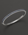 Blue sapphires stud a sterling silver bangle from Judith Ripka.