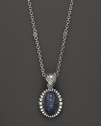 Shining blue sapphires are trimmed in fluted sterling silver on this Lagos pendant necklace.