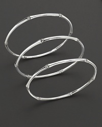 From the Bamboo collection, a set of 3 bamboo-inspired bangles, designed by John Hardy.