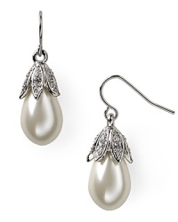 Pristine pavé crystals and a graceful glass pearl dangle lend this pair of silvery teardrop earrings forever allure. From Lauren Ralph Lauren.