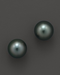 Naturally colored, cultured Tahitian black pearls make a statement on delicate stud earrings. From Tara Pearls.