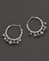 Inspired by Zen philosophy, these hoop earrings from Paul Morelli feature intricately detailed sterling silver meditation bells, set with pink rhodolite cabochons.