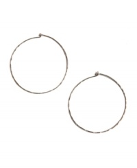 Trendy, chic, and timeless! The perfect accessory for any ensemble - these medium-sized hammered hoops by Lucky Brand feature a silver tone mixed metal setting. Approximate diameter: 2 inches.