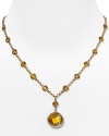 Crafted of gold plate and accented by a bold pendant, this eye catching necklace from Carolee will add the label's much adored glamor to every look.