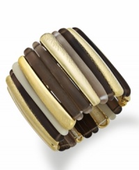 Stretch your style limits. Alfani's two-tone cuff bracelet slips over the wrist for added appeal. Crafted in gold tone mixed metal with brown resin. Stretches to fit the wrist. Approximate length: 7-1/2 inches. Approximate diameter: 2 inches.