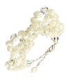 Go for a subtle hint of shimmer, or a standout look. This beautiful bracelet highlights cultured freshwater pearls and sparkling Swarovski crystal accents. Set in sterling silver. Approximate length: 6-1/4 inches + 2-inch extender.