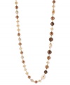 Go to greater lengths. This necklace from Kenneth Cole New York is crafted from gold-tone mixed metal and features a stunning array of brown glass pearls and beads. Item comes packaged in a signature Kenneth Cole New York Gift Box. Approximate length: 43 inches. Approximate drop: 1/2 inch.